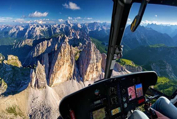 Helicopter Flying Over the Dolomites